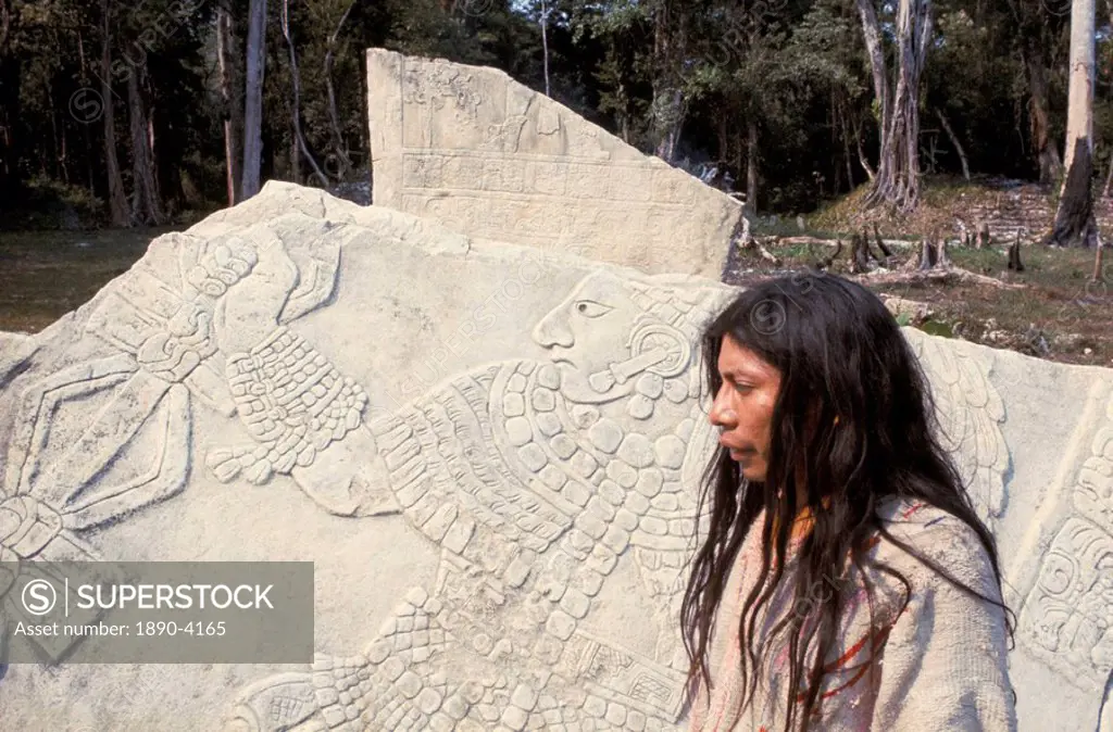 Lacandon Indian from Bonampak in front of Mayan stele, Mexico, North America