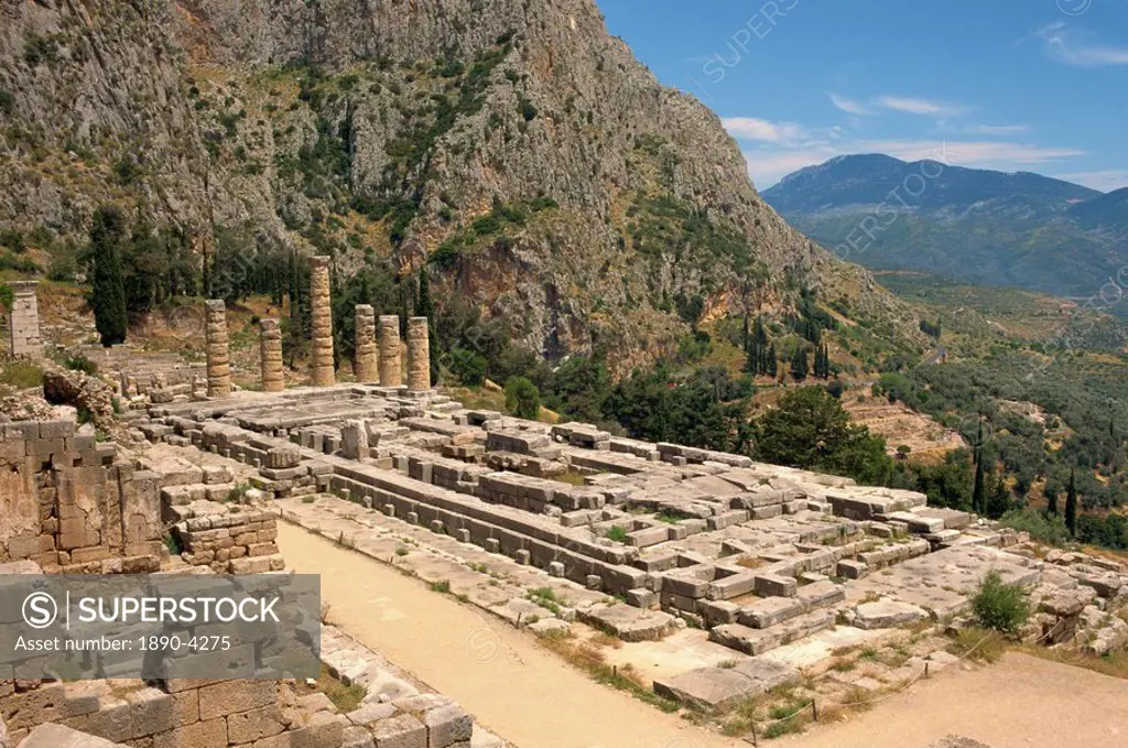 Ruins of the Temple of Apollo, with hills in the background, at Delphi, UNESCO World Heritage Site, Greece, Europe
