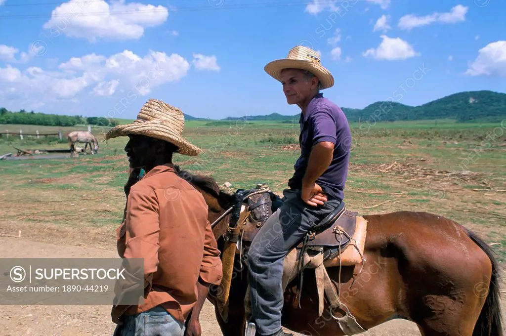 Men on the Guainamaro sugar plantation, Valley de los Ingenios, Sancti Spiritus region, Cuba, West Indies, Central America