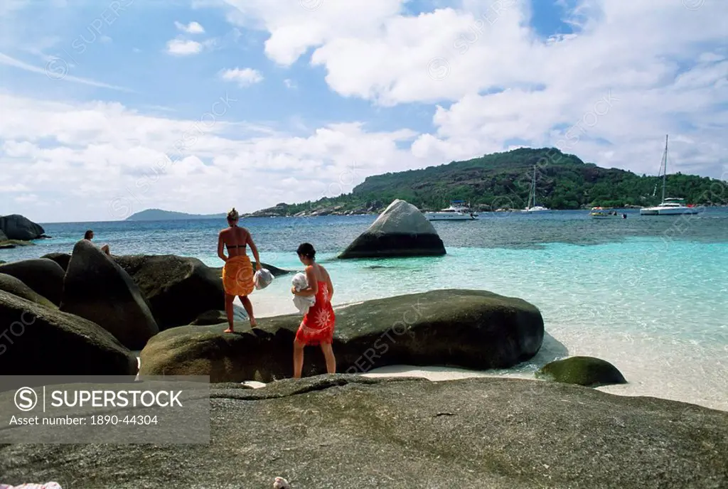 Tourists on rocks, Coco island, Praslin, Seychelles, Indian Ocean, Africa