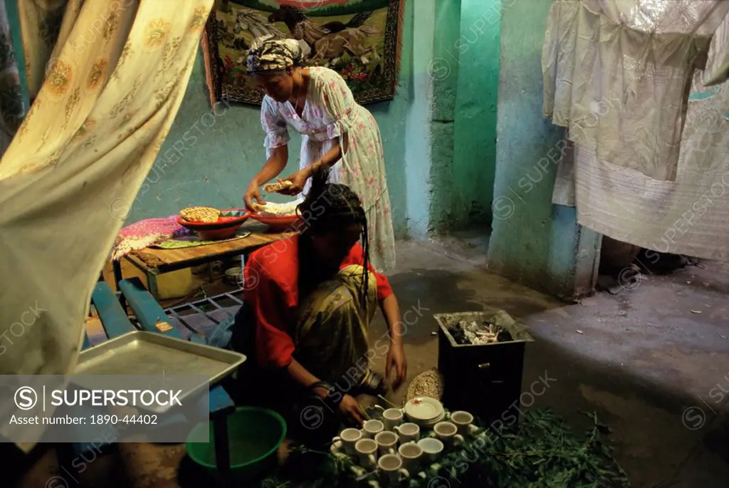 Women preparing food and drink for coffee ceremony, Abi Adi village, Tigre region, Ethiopia, Africa