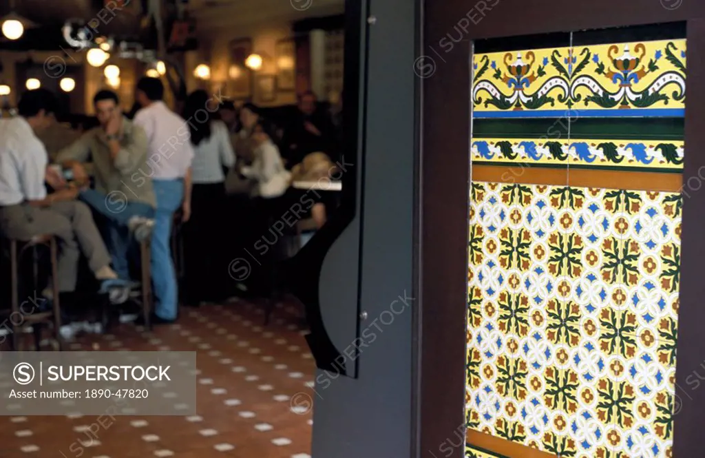 People inside a tapas bar and a detail of decorative tiled wall, Calle Maestro, Centro, Madrid, Spain, Europe