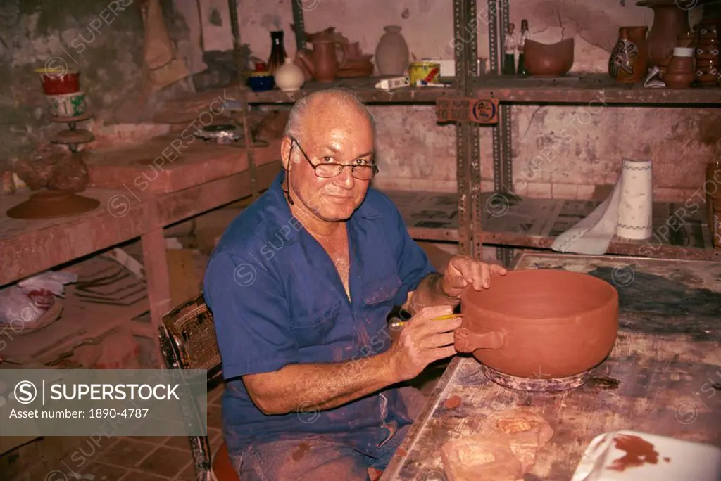 Portrait of a potter at work in the Old Town of San Juan, Puerto Rico, West Indies, Caribbean, Central America