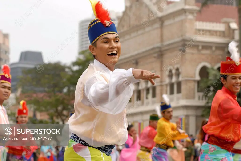 Malay female dancer wearing traditional dress at celebrations of Kuala Lumpur City Day Commemoration, Merdeka Square, Kuala Lumpur, Malaysia, Southeas...