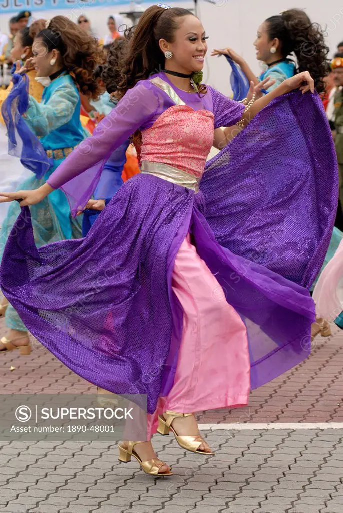 Malay female dancer wearing traditional dress at celebrations of Kuala Lumpur City Day Commemoration, Merdeka Square, Kuala Lumpur, Malaysia, Southeas...