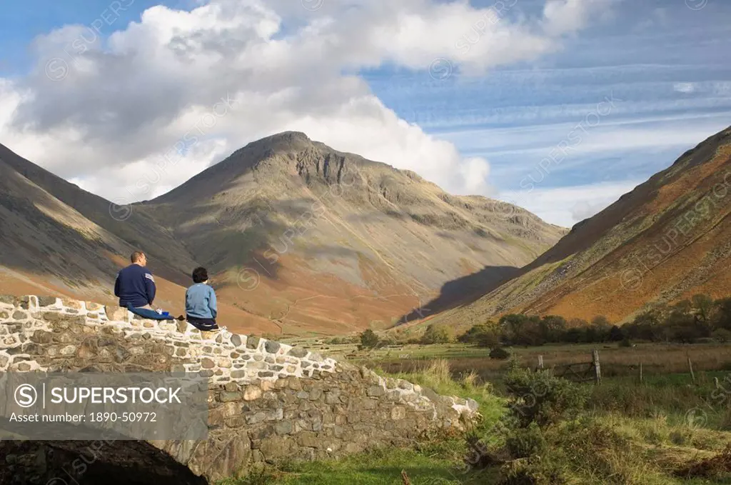 Two walkers resting, looking to Great Gable 2949ft, Wasdale Valley, Lake District National Park, Cumbria, England, United Kingdom, Europe