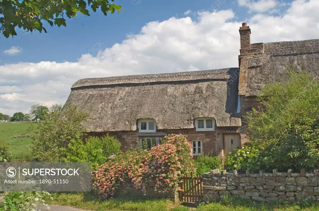 Original stone built and thatched cottage, circa 17th century, Eden Valley, Cumbria, England, United Kingdom, Europe