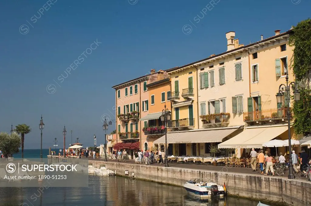 Harbour entrance and quayside cafes, Lazise, Lake Garda, Veneto, Italy, Europe