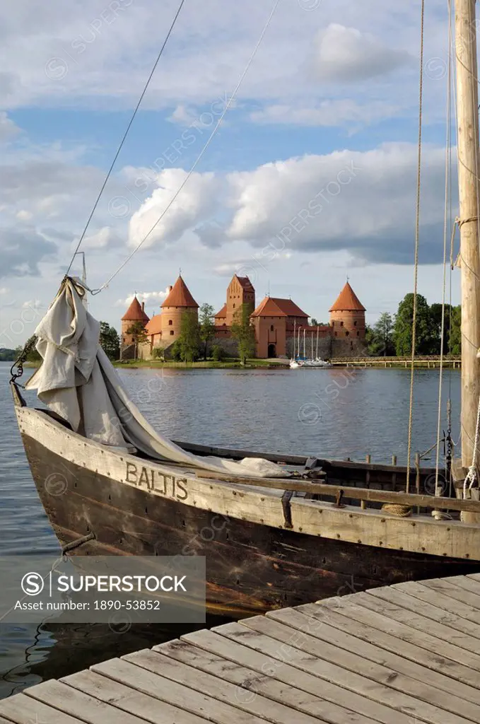 Traditional boat and Trakai Castle, Trakai, near Vilnius, Lithuania, Baltic States, Europe