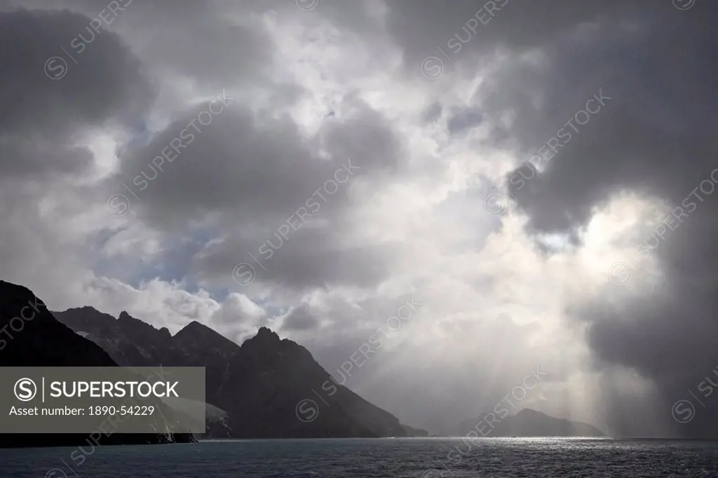 Mountainous coastline near Drygalski Fjord with cloudy skies, South Georgia, Polar Regions