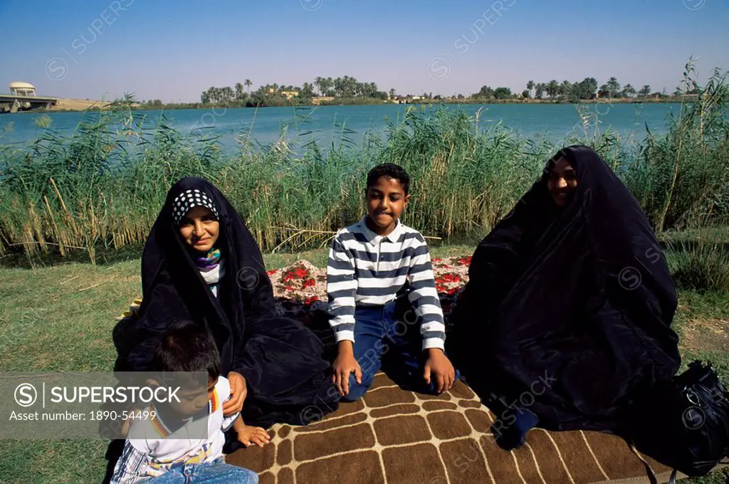 Family group beside the Tigris River, Iraq, Middle East