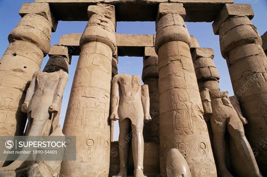 Colonnade and Osiris statues, Luxor Temple, Thebes, UNESCO World Heritage Site, Egypt, North Africa, Africa