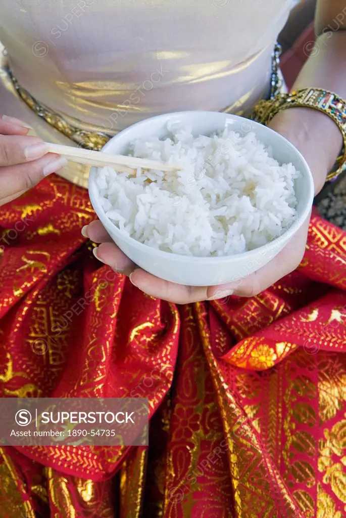 Hands holding a bowl of rice, Thailand, Southeast Asia, Asia