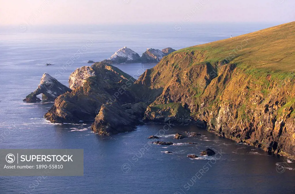 Cliffs of Hermaness Nature Reserve, looking north towards Vesta Skerry, Tipta Skerry gannetry, Muckle Flugga and its lighthouse in the distance, Unst,...