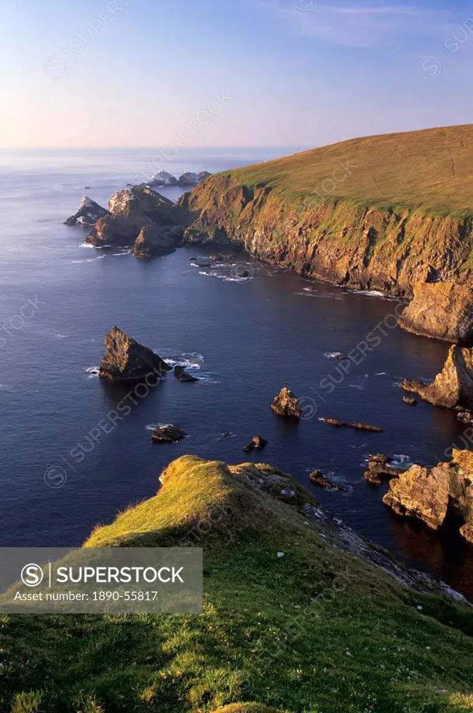 Cliffs of Hermaness Nature Reserve, looking north towards Vesta Skerry, Tipta Skerry gannetry, Muckle Flugga and its lighthouse in the distance, Unst,...