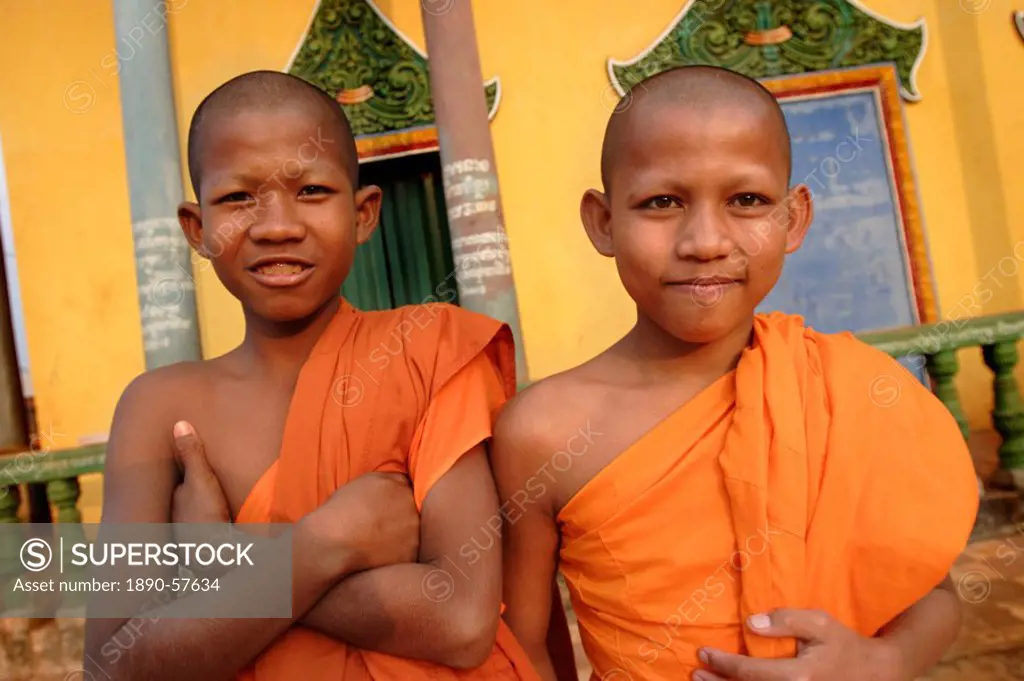 Young Buddhist novices relax outside their temple in Sen Monorom, Mondulkiri province, Cambodia, Indochina, Southeast Asia, Asia