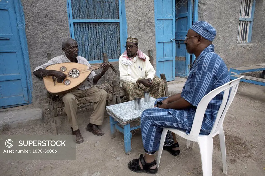 Locals relax with some traditional music, on the streets of Berbera, Somaliland, Somalia, Africa