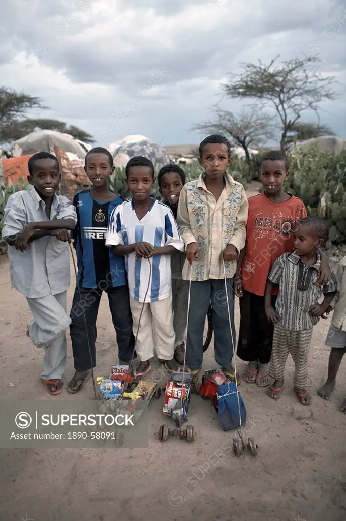 Children with home_made toys pose for a photograph in an Internally Displaced Persons camp in the city of Hargeisa, capital of Somaliland, Somalia, Af...
