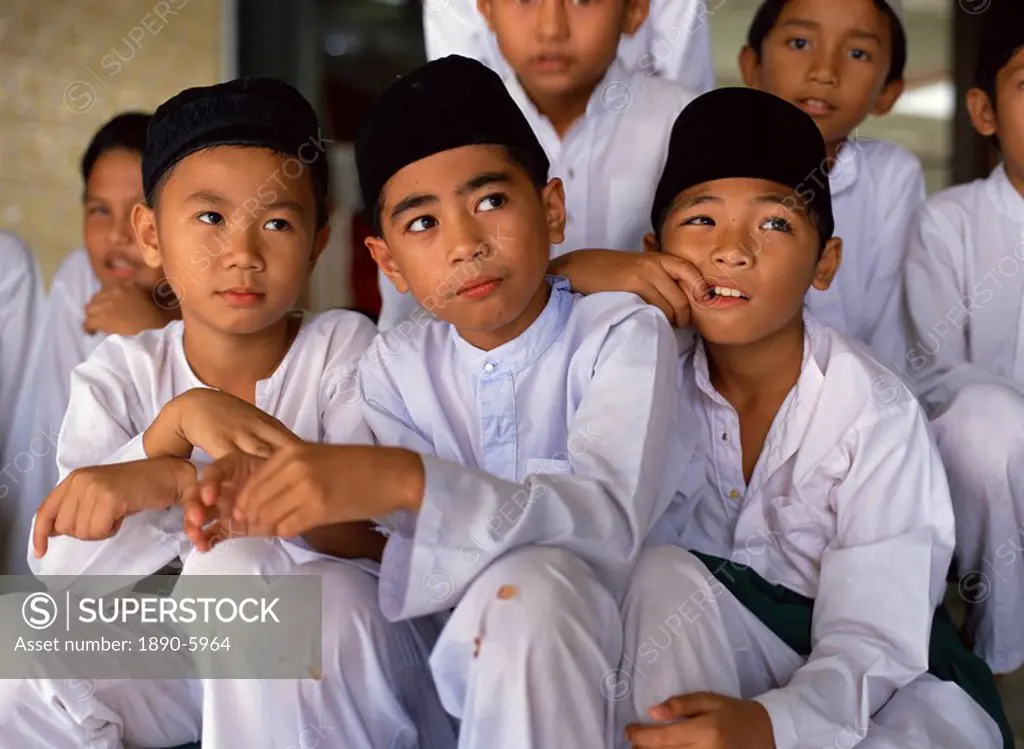 Portrait of a group of schoolboys at a mosque for religious classes in Kota Kinabalu, Sabah, Malaysia, Southeast Asia, Asia