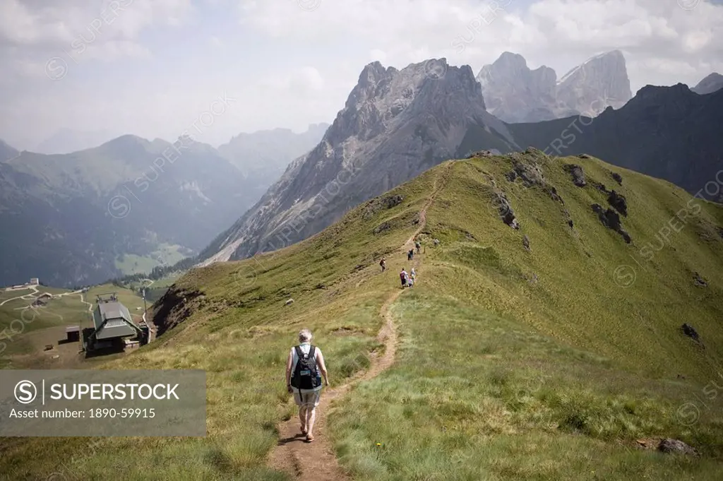 Walkers on footpath, Marmolada mountain, Dolomites, Italy, Europe
