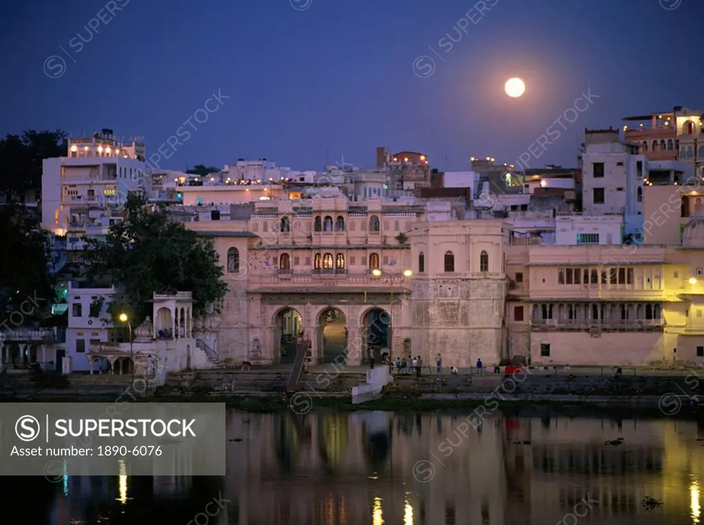 Moonlit view of Gangaur Ghat, with old city gateway, Udaipur, Rajasthan state, India, Asia