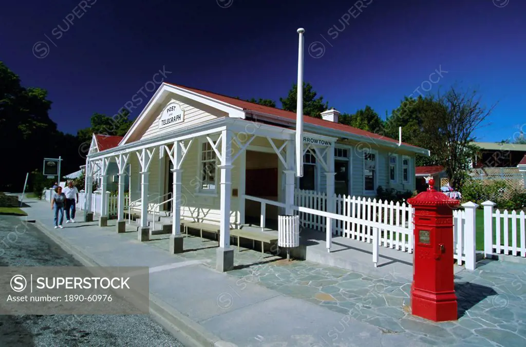 Post office and red post box in Arrowtown, a picturesque restored gold mining town, north east of Queenstown, west Otago, South Island, New Zealand, P...