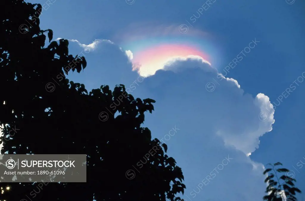 Rainbow atmospheric effect above cloud above the Ijen Plateau, Java, Indonesia, Southeast Asia, Asia