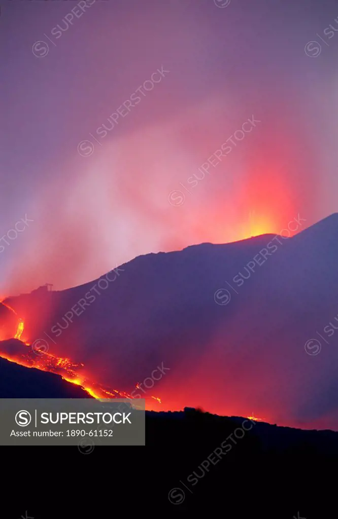 Lava flow from the Piano del Lago cone destroying the cable car above Rifugio Sapienza on the south flank of Mount Etna during the 2001 eruptions, Sic...