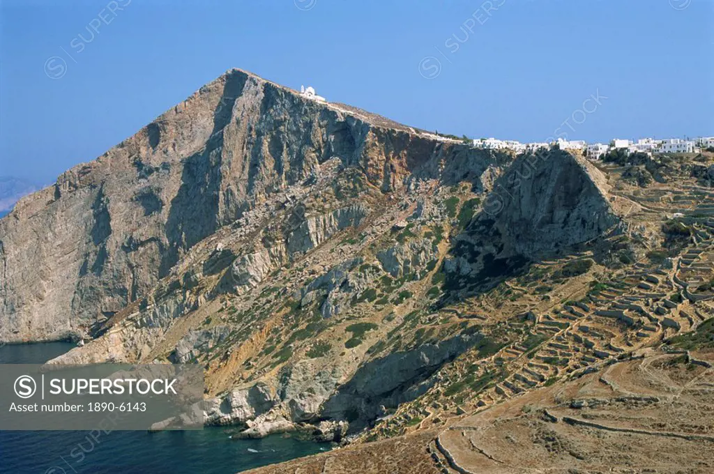 Chapel and Khora, main village perched on edge of cliffs, island of Folegandros, Cyclades, Greek Islands, Greece, Europe