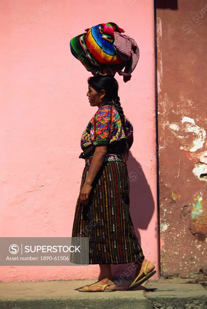 Indian woman carrying bundle on her head, Antigua, Guatemala, Central America