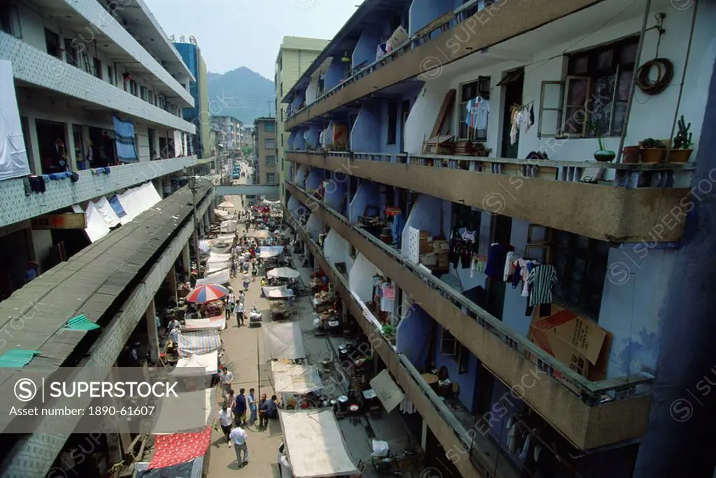 Traditional market below modern apartments at Longsheng, Guangxi, China, Asia