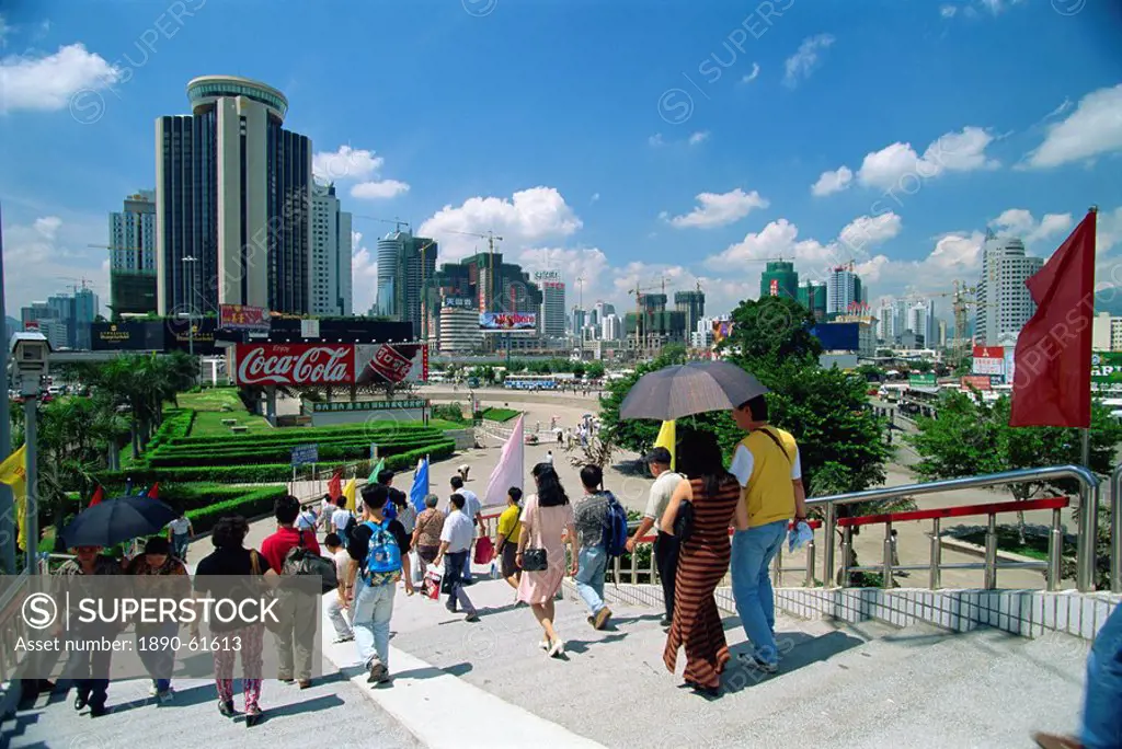 Street scene of pedestrian walkway in the centre of Shenzhen City in the Special Economic Zone boomtown on border with Hong Kong, China, Asia