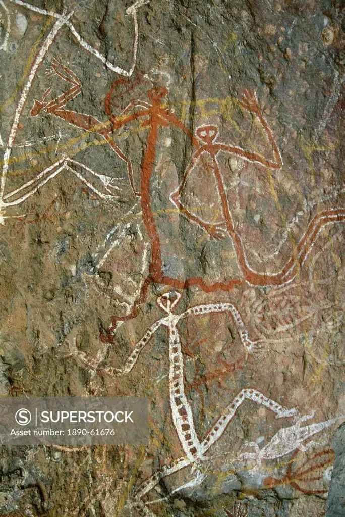 Painting of dancing figures at Nourlangie Rock, sacred aboriginal shelter and rock art site in the north east of Kakadu National Park, UNESCO World He...