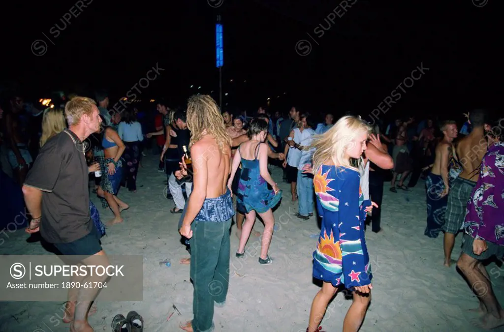 Tourists dancing at a full moon party at Haad Rin Beach at Koh Pha Ngan in Thailand, Southeast Asia Asia