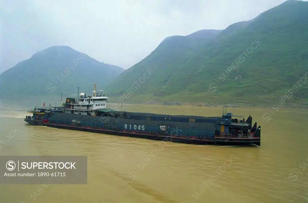 Coal barge on the scenic Three Gorges section of the Yangzi River between Wanxian and Yichang, China, Asia