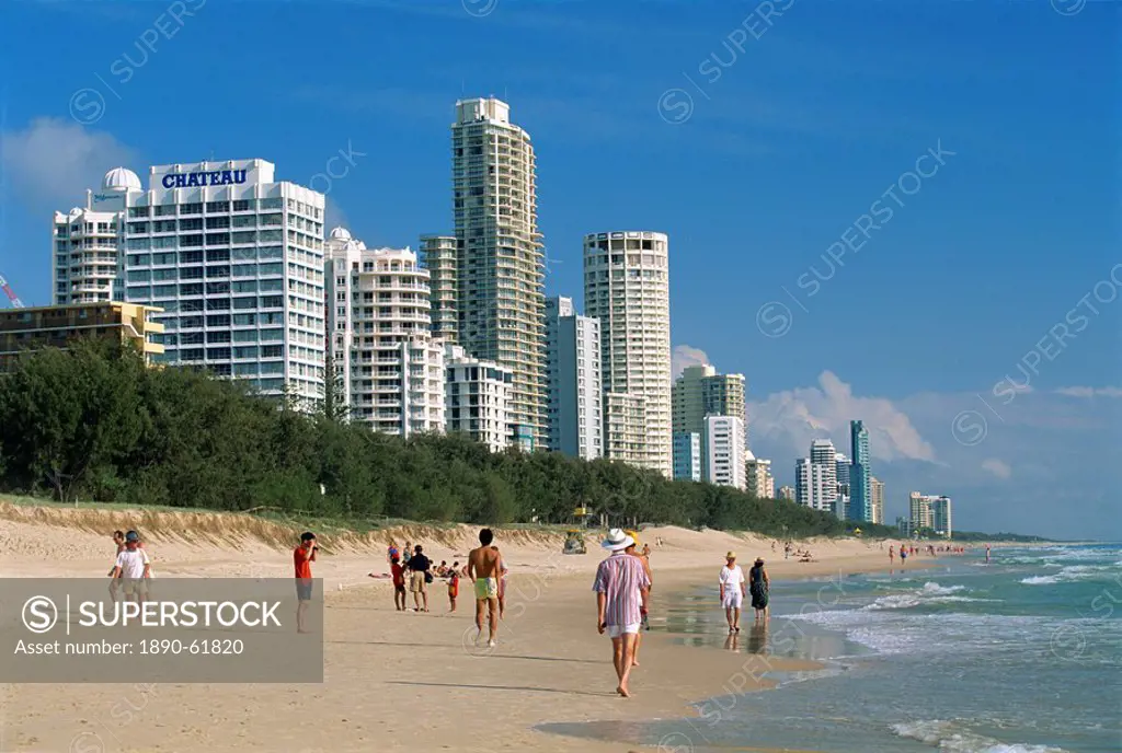 Morning walkers on the beach at the resort of Surfers Paradise on the Gold Coast of Queensland, Australia, Pacific