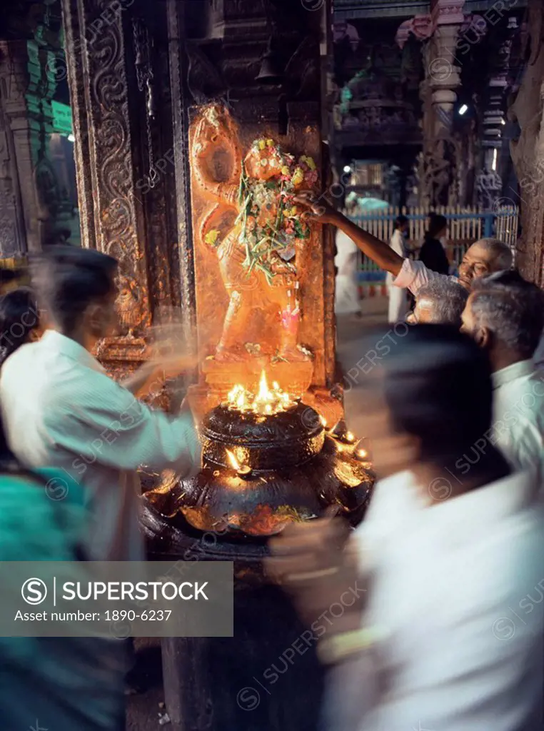 Worshippers at a shrine inside the Sri Meenakshi Temple, Madurai, Tamil Nadu state, India, Asia