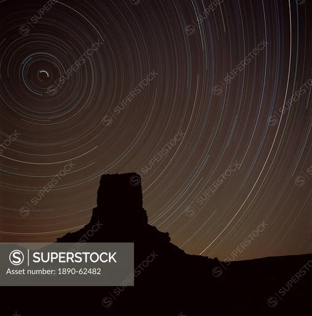 Star trek over Monument Valley, tracing stars moving round the North Star, Monument Valley, an area in Utah and Arizona, United States of America U.S....