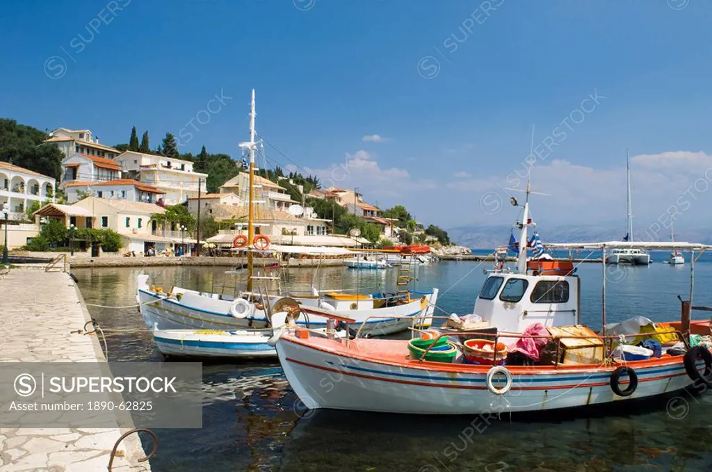 Fishing boats in the harbour in Kassiopi on the northeast coast of Corfu, Ionian Islands, Greek Islands, Greece, Europe