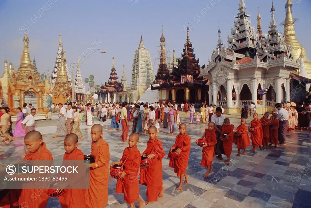Line of Buddhist monks with begging bowls, Shwedagon Shwe Dagon Pagoda, Yangon Rangoon, Myanmar Burma, Asia