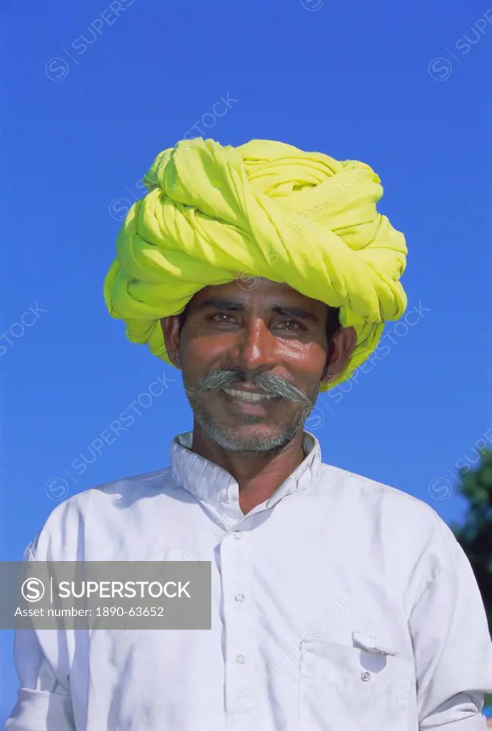 Portrait of a man in a yellow turban, Pushkar, Rajasthan State, India, Asia