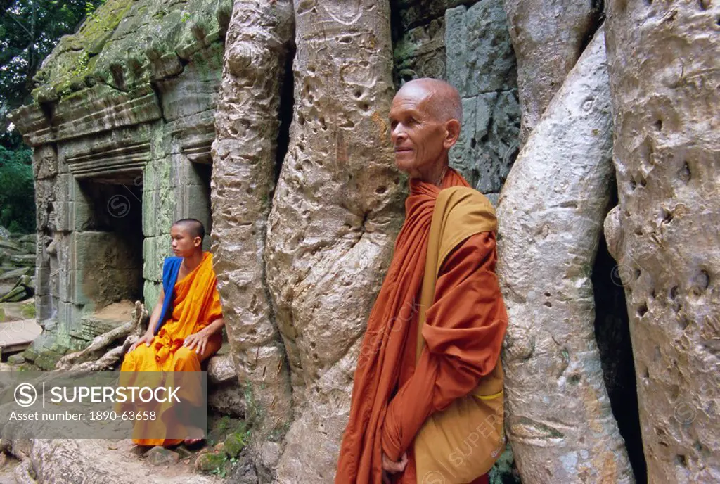 Buddhist monks in Ta Prohm temple, Angkor, UNESCO World Heritage Site, Siem Reap, Cambodia, Indochina, Asia