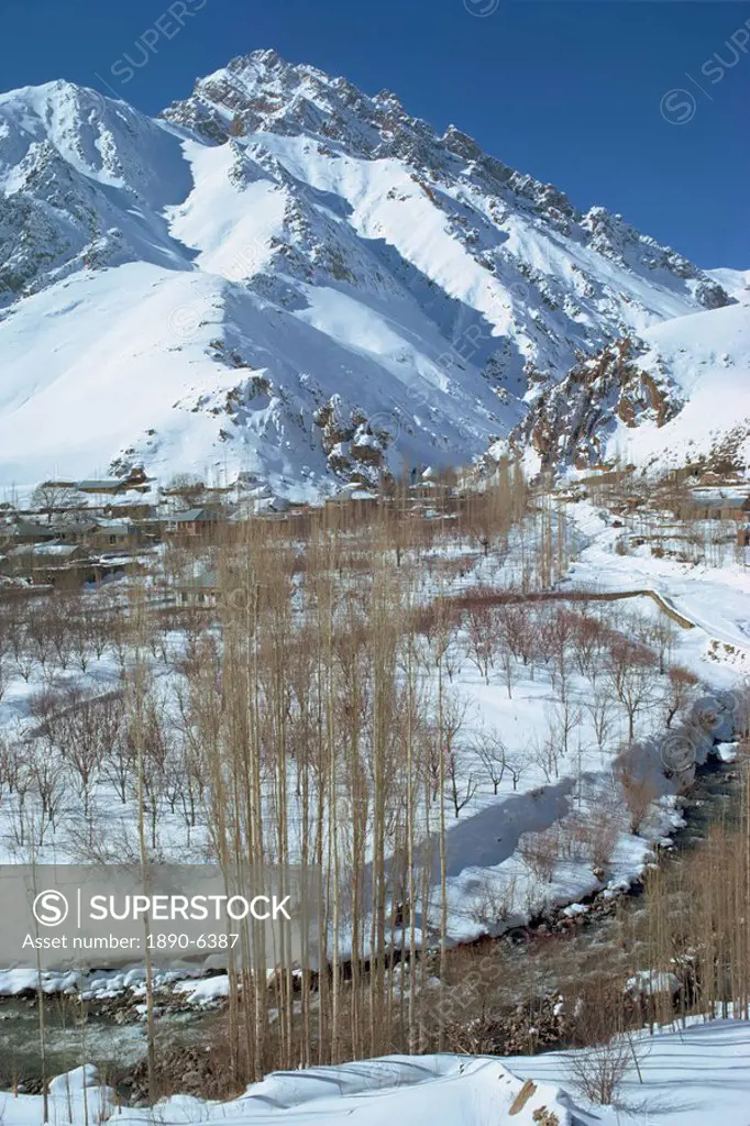River running through a snow covered Elborz Valley during winter, Iran, Middle East