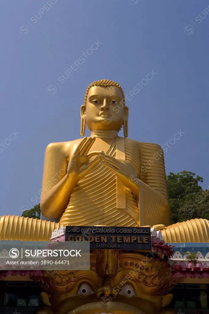 Giant gold seated Buddha statue at entrance to the Cave Temples, Golden Temple, Cave Temples, UNESCO World Heritage Site, Dambulla, Sri Lanka, Asia