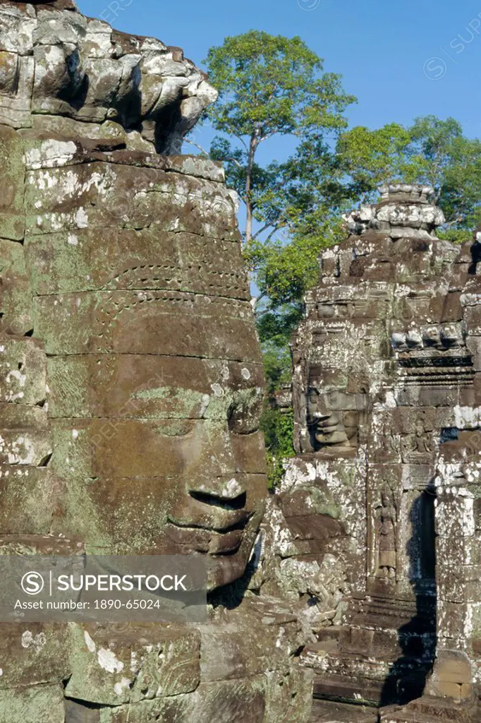 Myriad stone heads typifying Cambodia in the Bayon Temple, Angkor, Siem Reap, Cambodia