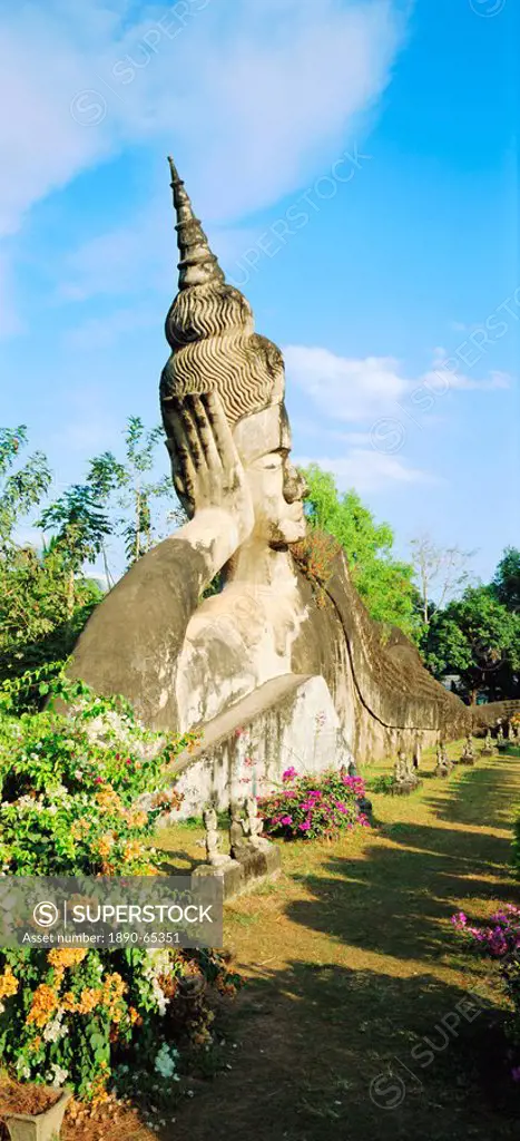 Reclining Buddha statue in the open at Xieng Khuan, Vientiane, Laos