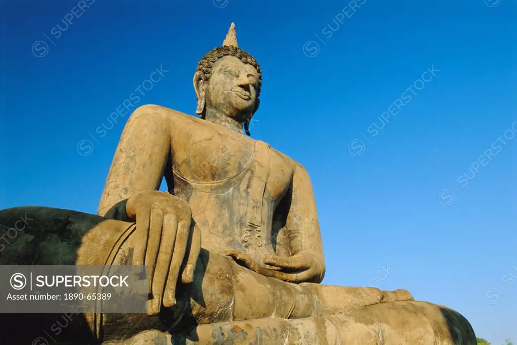 Seated Buddha statue in the Historical Park, old Sukhothai Muang Kao, Sukhothai, Thailand