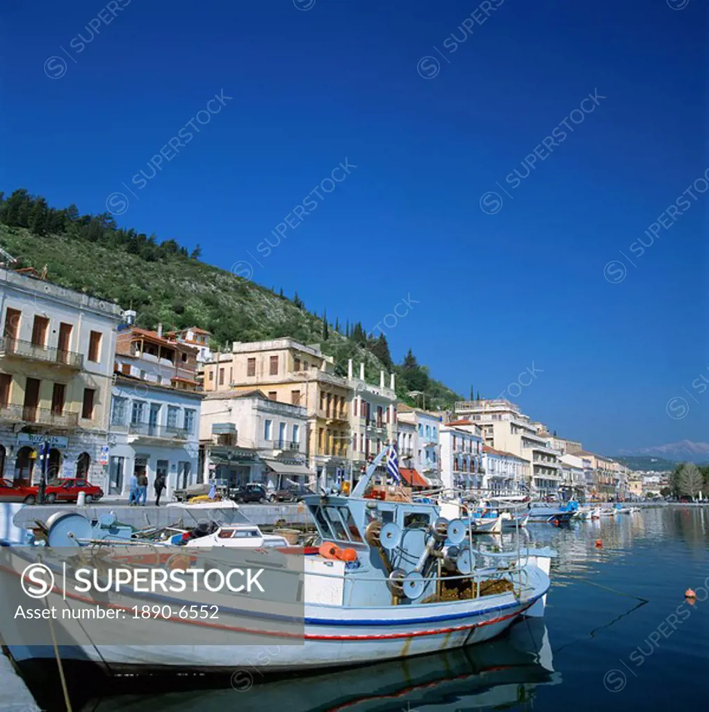 Boats and buildings on the waterfront in the seaside market and port town of Neapoli, Peloponnese, Greece, Europe