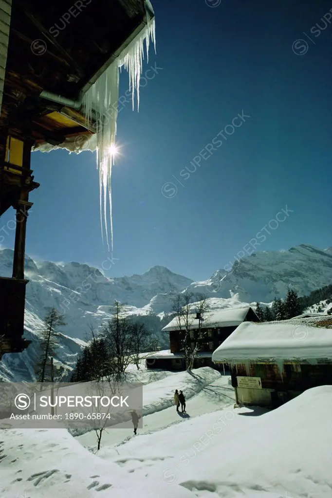 Icicles on chalet and deep snow, Swiss Alps, Switzerland, Europe