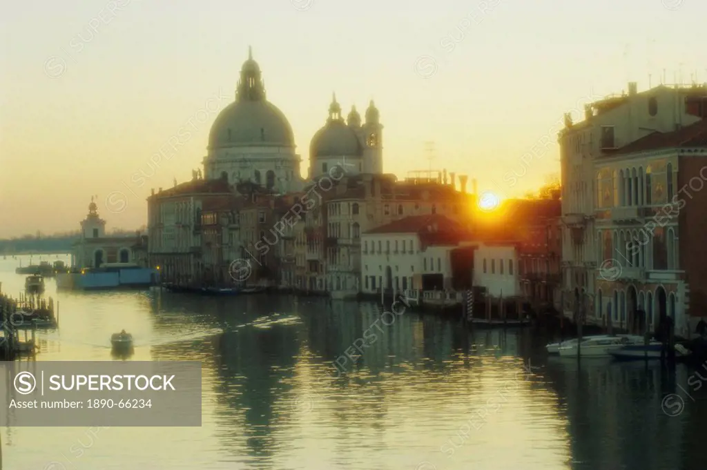 Sunrise behind Santa Maria Della Salute church from Academia Bridge, Venice, Veneto, Italy